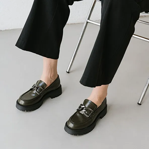 Flat heel loafers with bites in glazed khaki leather