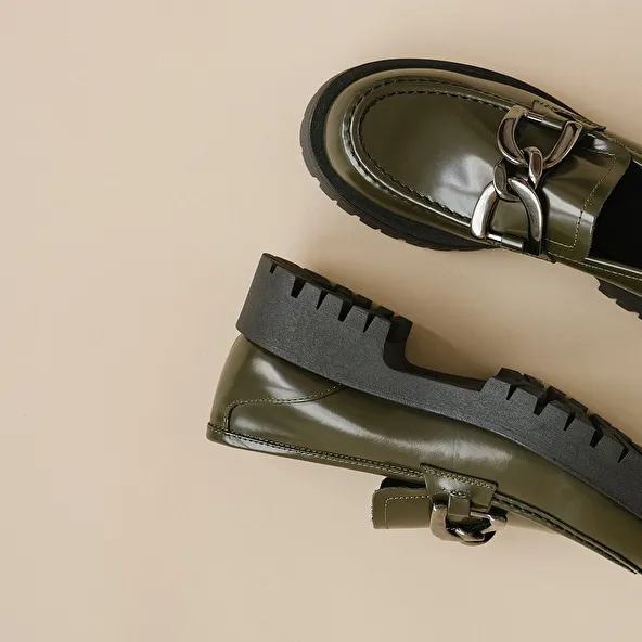 Flat heel loafers with bites in glazed khaki leather